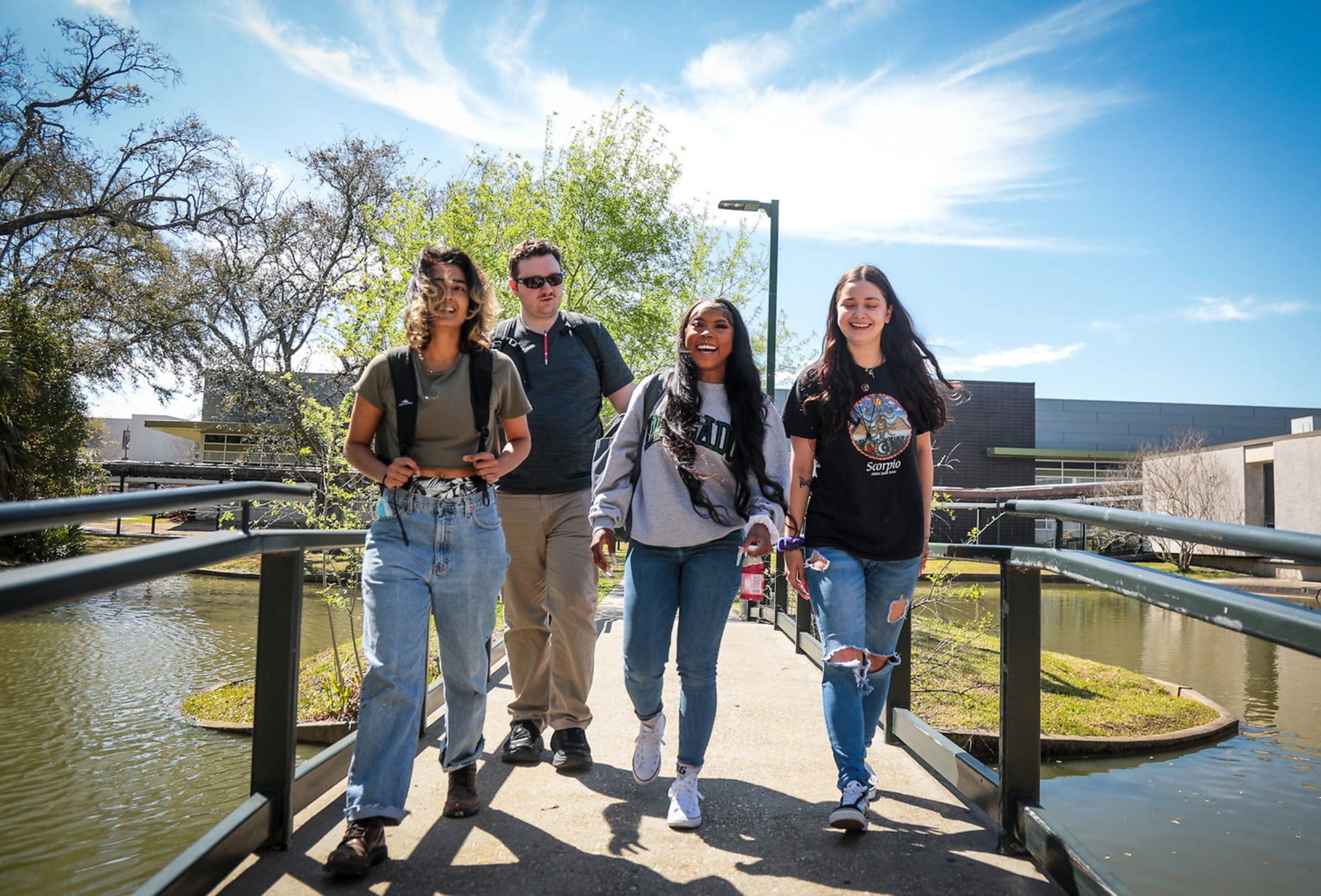 College students walking on a bridge