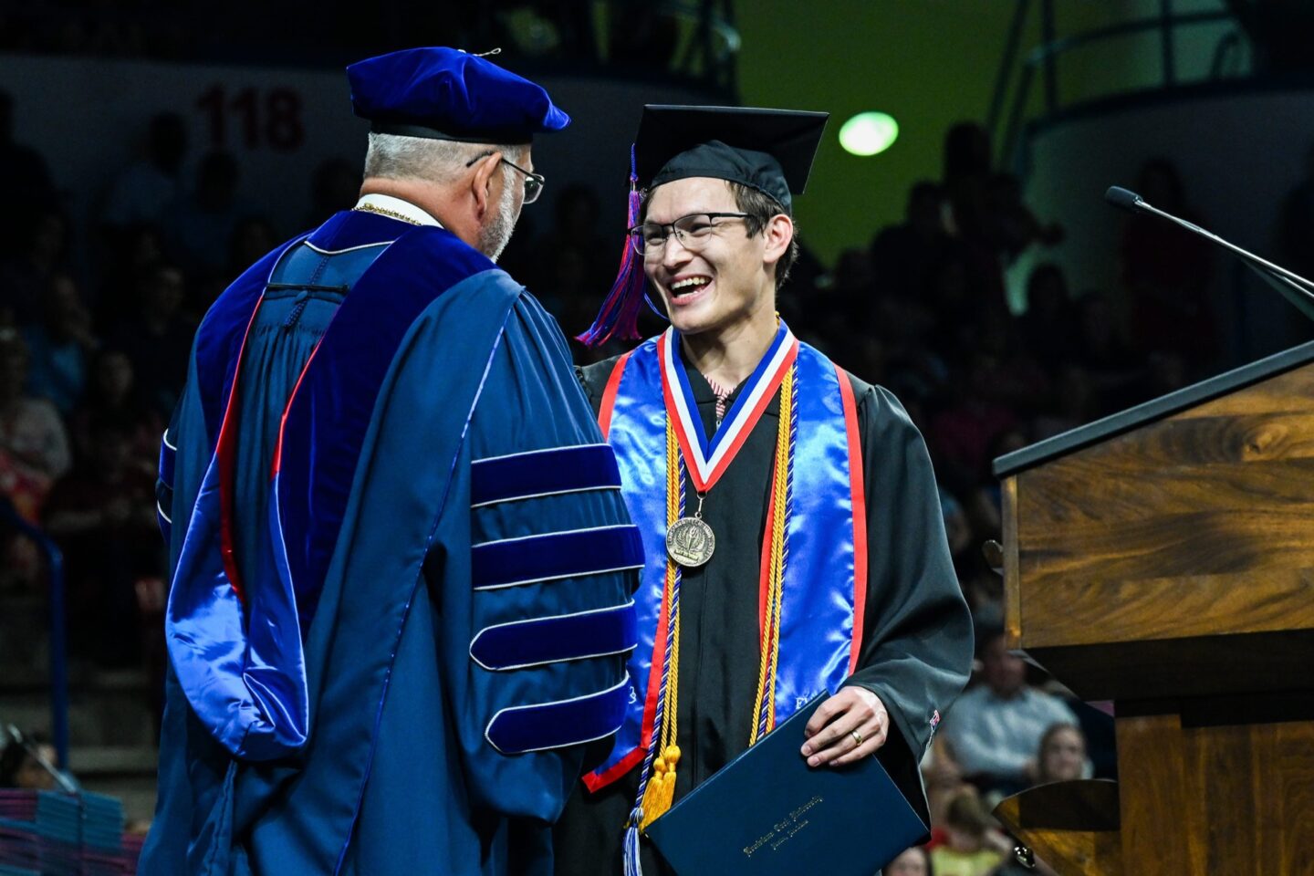 Young Man Receiving His College Diploma