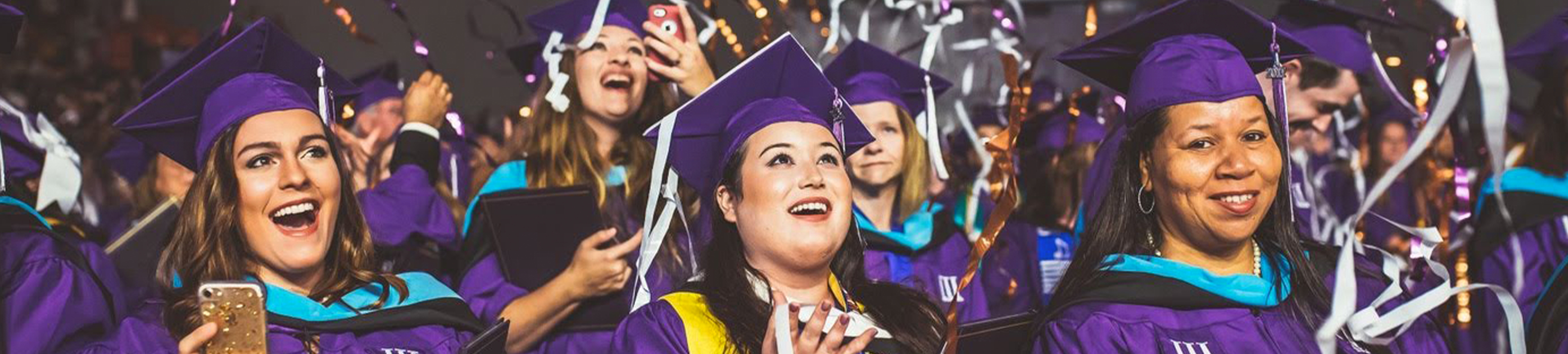 college students at graduation ceremony