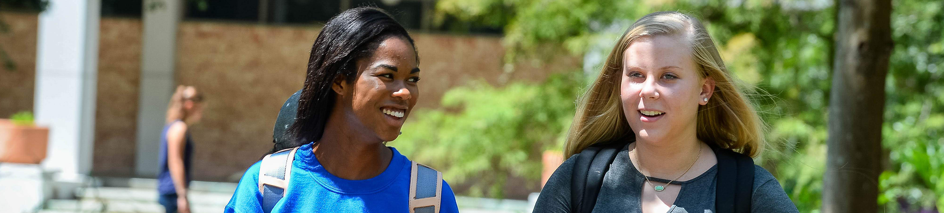 students walking and talking on their way to the classroom