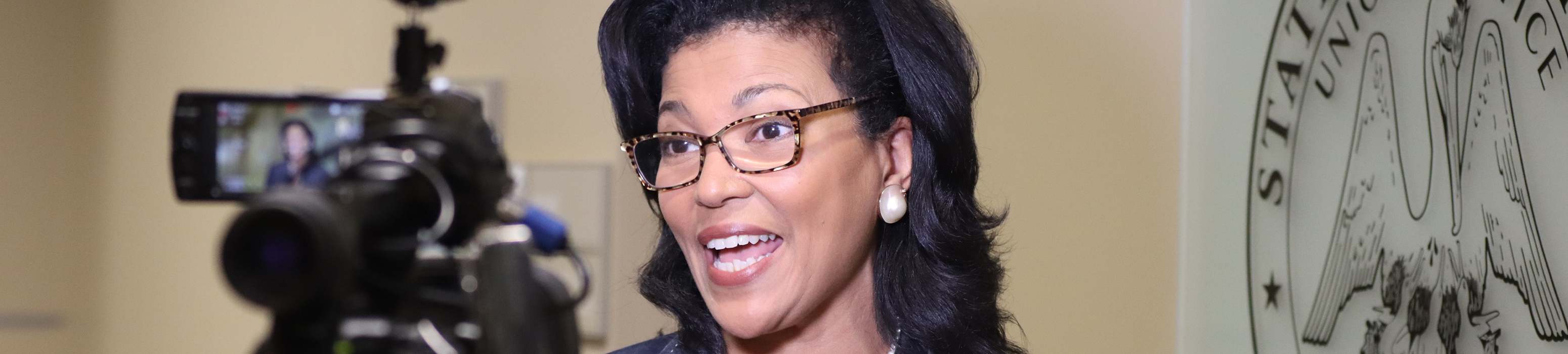 strategic communications officer speaking to press